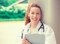 Confident female doctor medical professional standing outside Royalty Free Stock Photo