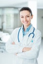 Confident female doctor posing in her office Royalty Free Stock Photo
