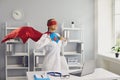 Confident female doctor superhero in a hospital office. Medical protection of human health.