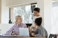 Confident female Indian team leader instructing employees at workplace Royalty Free Stock Photo