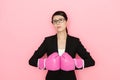 Confident female lawyer wearing boxing gloves Royalty Free Stock Photo