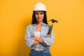 Female manual worker in helmet holding Royalty Free Stock Photo