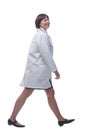 confident female paramedic striding forward. isolated on a white background. Royalty Free Stock Photo