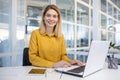 Empowered businesswoman working happily in office