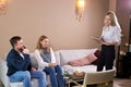 Confident female psychologist talking with patients married couple Royalty Free Stock Photo