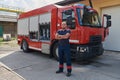 Confident firefighter stands with crossed arms, exuding resilience and preparedness, ready to respond to emergencies