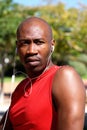 Confident fitness african man with earphones