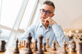 Confident focused business man playing chess Royalty Free Stock Photo