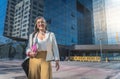 Confident, focused and powerful business woman walking in the street. Female corporate professional going or leaving the Royalty Free Stock Photo