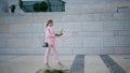 Confident freelancer working go holding laptop. Woman walking looking computer Royalty Free Stock Photo