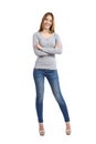 Confident full body of a casual happy woman standing wearing jeans Royalty Free Stock Photo