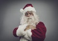 Confident funny santa posing with arms crossed