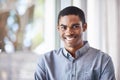 Confident about the future. Portrait of a handsome young man standing by a window in his home. Royalty Free Stock Photo