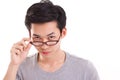 Confident genius nerd man looking at you, hand holding eyeglasses Royalty Free Stock Photo