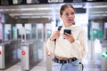 Confident girl entered the subway, passing through the turnstile Royalty Free Stock Photo