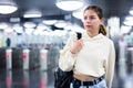 Confident girl entered the subway, passing through the turnstile Royalty Free Stock Photo