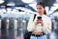 Confident girl entered the subway, passing through the turnstile Royalty Free Stock Photo