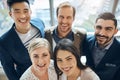 Confident and going places. Portrait of a group of confident young businesspeople standing together in the office at Royalty Free Stock Photo