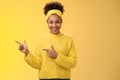 Confident good-looking millennial feminine african-american woman headband sweater look self-assured assertive pointing