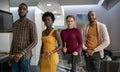 Confident group of diverse young businesspeople standing in an office Royalty Free Stock Photo