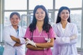 Confident Group of Nepali Indian Nurse and Doctors Smiling with hands crossed