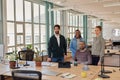 Confident group of young businesspeople working together in an office Royalty Free Stock Photo