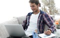 Confident guy working with laptop at home. Royalty Free Stock Photo