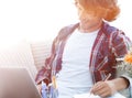 Confident guy working with laptop at home. Royalty Free Stock Photo