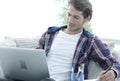 Confident guy working with laptop at home. Royalty Free Stock Photo