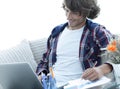 Confident guy working with laptop at home. Royalty Free Stock Photo