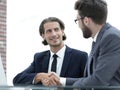Confident handshake colleagues in the office Royalty Free Stock Photo