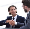 Confident handshake colleagues in the office Royalty Free Stock Photo