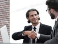 Confident handshake colleagues in the office Royalty Free Stock Photo