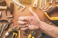 Confident handyman giving thumb up approval hand sign, top view