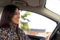 Confident and happy young brunette lady driving in a car Royalty Free Stock Photo