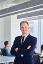 Confident happy young business man team manager standing in office. Vertical Royalty Free Stock Photo