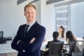 Confident happy young business man team manager standing in office looking away. Royalty Free Stock Photo