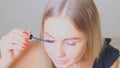 Confident happy young woman holding mascara apply on eyeleashes prepare getting ready in the morning, smiling beautiful Royalty Free Stock Photo