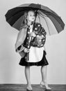 Confident in her fall garments. Waterproof accessories manufacture. Kid girl happy hold colorful umbrella wear
