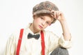 Confident in her style. teen girl in retro suit. suspender and bow tie. old fashioned child in checkered beret. vintage