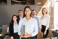 Confident hispanic business woman in office