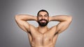 Confident hot young middle eastern guy enjoying his muscular body Royalty Free Stock Photo
