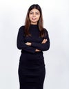Confident Indian  businesswoman standing with crossed hands and smiling Royalty Free Stock Photo
