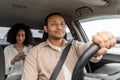 Confident Indian Taxi Driver Navigating Car With Passenger Woman Royalty Free Stock Photo