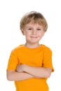 Confident little boy in a yellow shirt