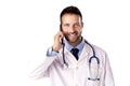 Confident male doctor making a call while standing at isolated white background Royalty Free Stock Photo