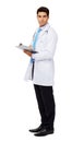 Confident Male Doctor Writing On Clipboard Royalty Free Stock Photo