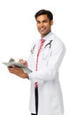 Confident Male Doctor Writing On Clipboard Royalty Free Stock Photo