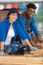 confident male and female carpenters in workshop Royalty Free Stock Photo