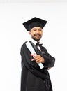 Confident male graduate wearing a toga and holding certificate paper